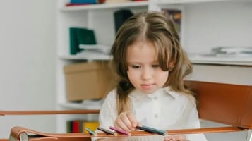 Child focused on an activity.