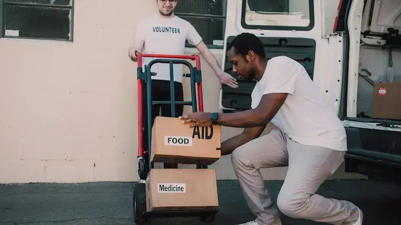 Volunteers loading a truck with Non-profit items