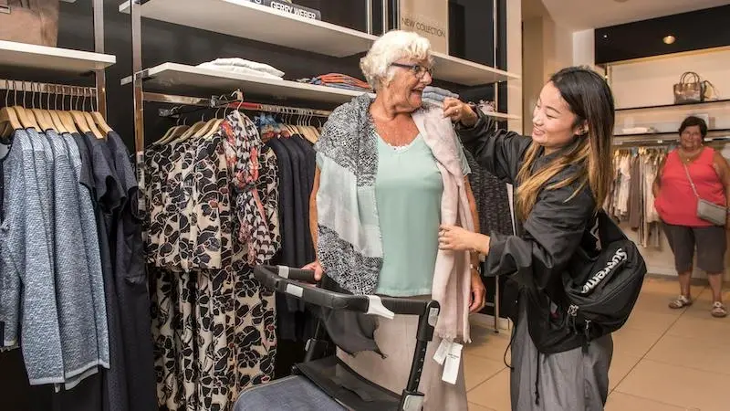 Individualized Community Support Worker helps her client. 